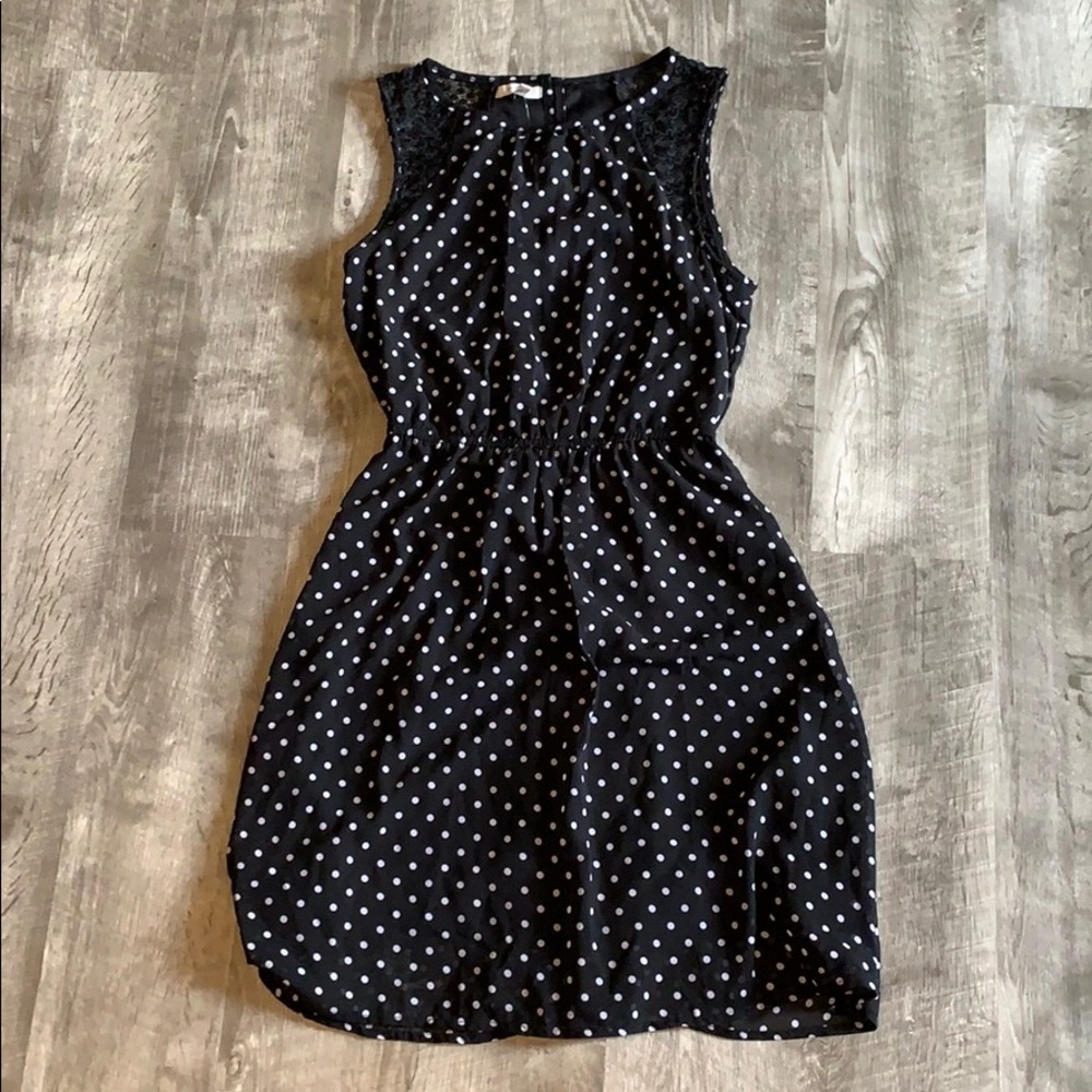 Black and white polka dotted sleeveless dress